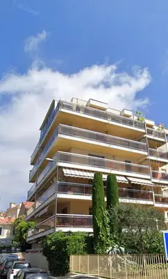 a tall building with trees in front of it at Le Week Riviera - Spacieux 3 étoiles-Coeur de Cannes - Palais des Festivals- Terrasse - Clim- Garage in Cannes