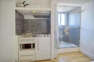 a kitchen with a sink and a glass shower at IMMOGROOM - 2 min from the Palais des Festival and the beaches - ac in Cannes