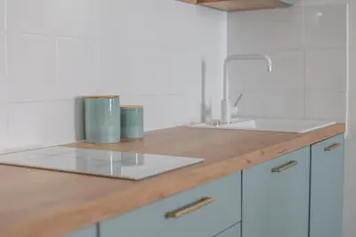 a white kitchen with a sink and a counter at IMMOGROOM - Best place in Cannes Center - AC - 5 min from beaches in Cannes