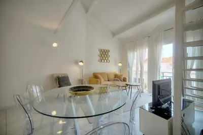 a living room with a glass table and a couch at IMMOGROOM - Duplex with air conditioner - 5 min from the beach - Suquet in Cannes