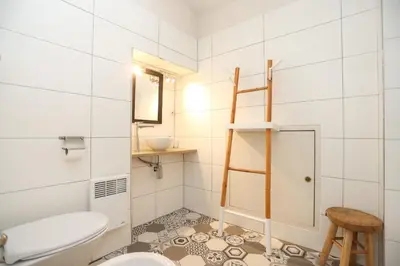 a bathroom with a toilet and a sink at IMMOGROOM - Duplex with air conditioner - 5 min from the beach - Suquet in Cannes