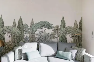 a living room with a couch and a mural of trees at Alba in Cannes