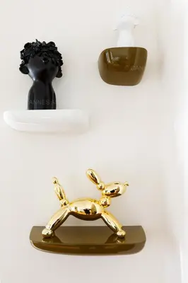 a gold model of a dog on a plate at Alba in Cannes