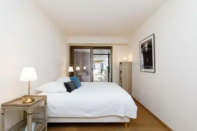 a bedroom with a bed and a side table at GRAY 4f1 in Cannes