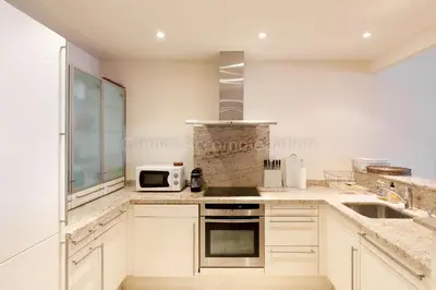 a kitchen with a stove and a microwave at GRAY 4f1 in Cannes