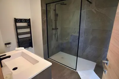 a bathroom with a shower and a sink at La Villa d’Emma in Mougins