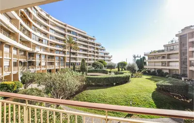 a balcony of a apartment building with a garden at 2 Bedroom Amazing Apartment In Cannes in Cannes