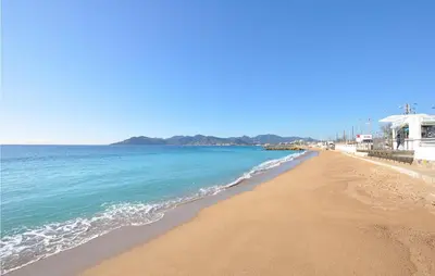 a view of a beach with the ocean at 2 Bedroom Amazing Apartment In Cannes in Cannes