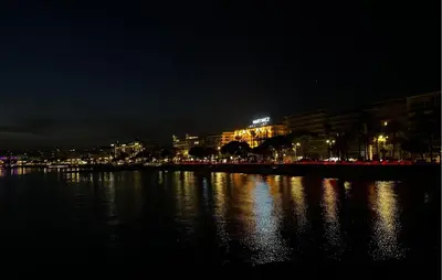 a city at night with lights on the water at 2 Bedroom Amazing Apartment In Cannes in Cannes