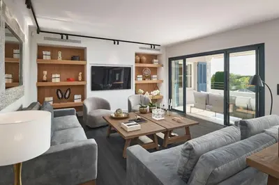 a living room with a couch and a table at Cannes magnifique villa vue mer basse Californie in Cannes