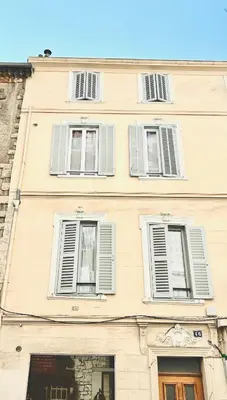 aige building with white shuttered windows on it at 1 Bedroom flat with Balcony Cannes Center Croisette 6ppl in Cannes