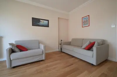 a living room with two chairs and a couch at Charming Stanislas Studio with Wi-Fi and Air Conditioning in Cannes