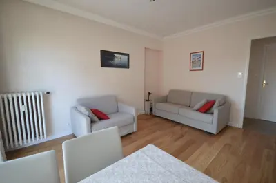 a living room with two chairs and a couch at Charming Stanislas Studio with Wi-Fi and Air Conditioning in Cannes