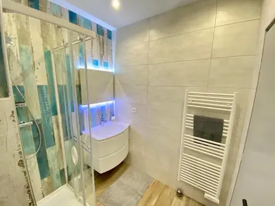 a bathroom with a shower and a sink at Le Florian By SCLS Locations in Cannes