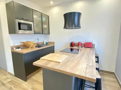 a kitchen with a counter top and a sink at Le Florian By SCLS Locations in Cannes