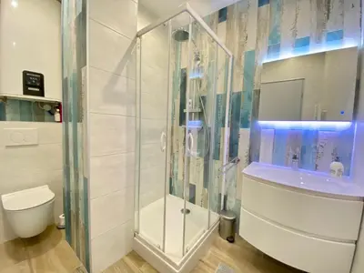 a bathroom with a shower and a toilet and a sink at Le Florian By SCLS Locations in Cannes