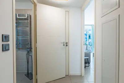 a bathroom with a shower and a glass door at 1-Br apartment in Palm Beach swimming pool in Cannes