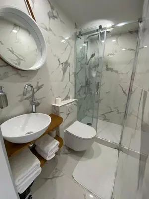 a bathroom with a shower and a toilet and a sink at Studio centre ville cannes in Cannes