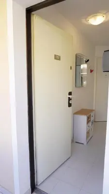 a white door in a room with a desk at Appartement 753, 4 personnes, vue mer By Palmazur in Cannes