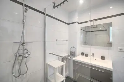 a bathroom with a sink and a shower at FRGK FR - Surcouf 'PALM BEACH ' in Cannes