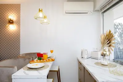 a kitchen with a counter with a bowl of fruit on it at Perle Dorée YourHostHelper in Cannes