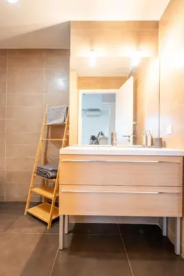 a bathroom with a large sink and a mirror at Joli studio centre Cannes in Cannes