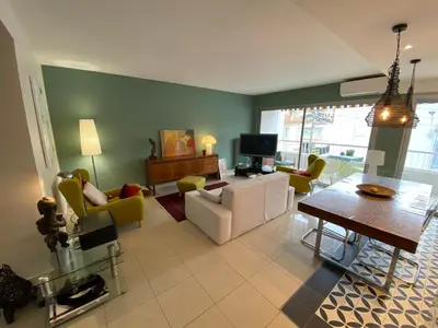 a living room with a couch and chairs and a table at Grand appartement de style avec parking - Cannes in Cannes