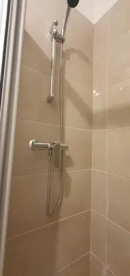 a shower with a hose in a bathroom at Le Suquet in Cannes