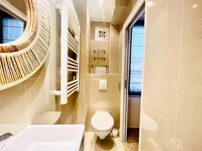 a bathroom with a toilet and a sink and a tub at Cannes centre , magnifique , 5 min palais in Cannes