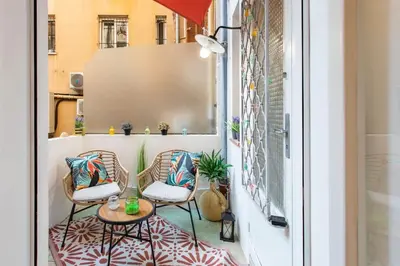 a balcony with two chairs and a table at C6 - Studio Rue Félix Faure 2 min Palais Festivals - AC & Balcony in Cannes