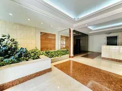 a large lobby with a large plant at Cannes Center - Appartement 2 pièces avec terrasse in Cannes