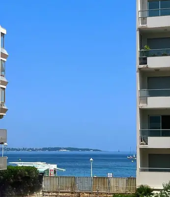a view of the ocean from a apartment building at Cool Appart sur Croisette Palm Beach in Cannes
