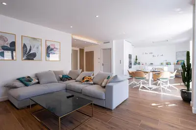 a living room with a couch and a table at Luxury Apt With Balcony On Famous Rue D'antibes! - Kiss Apartment by Halldis in Cannes