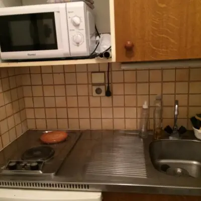 a kitchen counter with a sink and a microwave at Studio à 5 minutes à pied des plages et de la croisette in Cannes