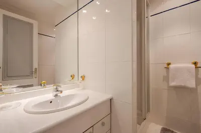 a bedroom with a large bed and a window at NEWLY RENOVATED! Harbour View on Balcony Terrace in Cannes