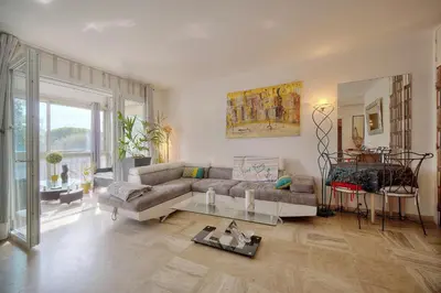 a living room with a couch and a table at Le Jak - 2 Pièces - Loggia - VCA in Cannes