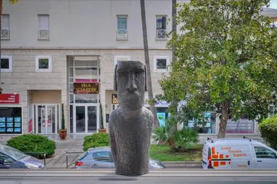a statue of a head in the middle of a street at Le Jak - 2 Pièces - Loggia - VCA in Cannes
