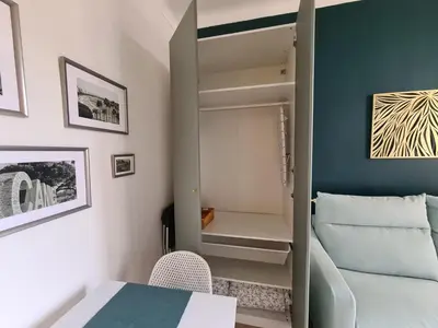a small room with a table and a cupboard at Studio 700 m du Palais et Croisette - Le St Jean in Cannes