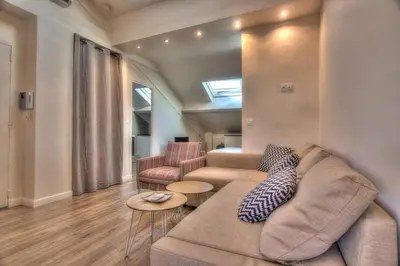 a living room with a couch and two chairs at 9E - Appartement 1 chambre in Cannes