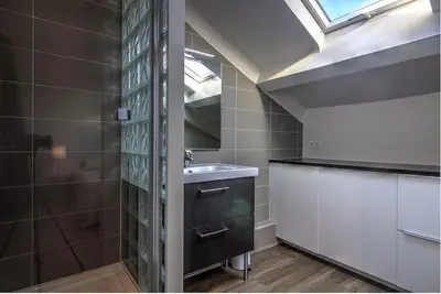 a bathroom with a sink and a mirror at 9E - Appartement 1 chambre in Cannes