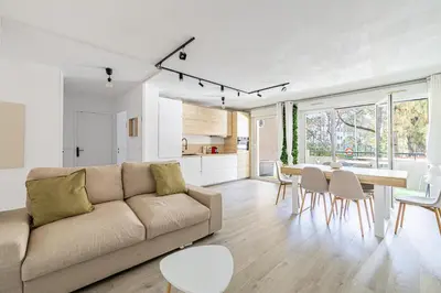 a living room with a couch and a table at Montfleury cannes in Cannes