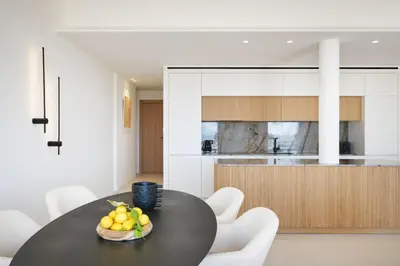 a table with a bowl of fruit on it in a kitchen at Les DUNES 3 BEDS CROISETTE BEACHES Sea VIEW in Cannes