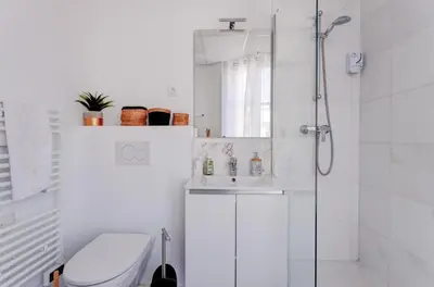 a bathroom with a shower and a toilet and a sink at LA PANTHERE studio design central et calme, idéal pour un séjour en couple ou congrès in Cannes