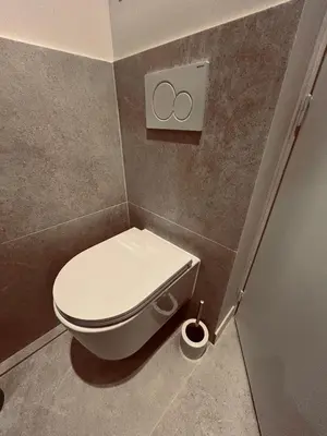 a bathroom with a white toilet in a room at KOSY Spa, Les Princes in Cannes
