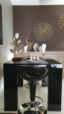 a black desk with a stool in a room at Mélodie Garage Gratuit in Cannes