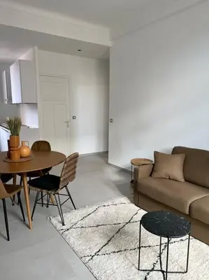 a living room with a couch and a table at T2 Cannes centre - Appartement cosy proche Palais in Cannes