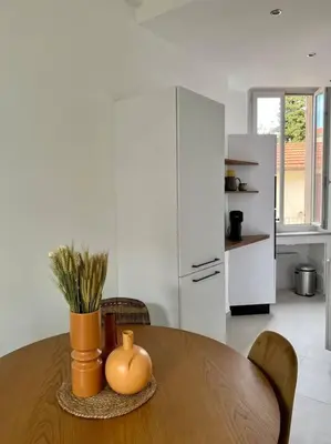 a kitchen with a wooden table with a pumpkin on it at T2 Cannes centre - Appartement cosy proche Palais in Cannes