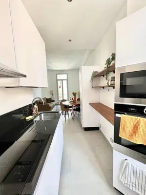 a kitchen with a sink and a stove top oven at T2 Cannes centre - Appartement cosy proche Palais in Cannes