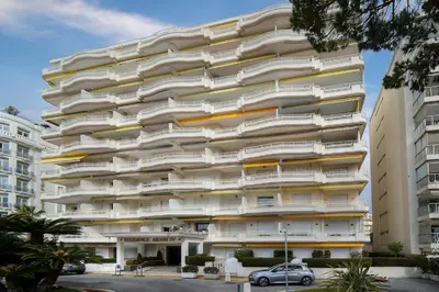 a building with balconies on the side of it at Buckingham & Lloyds - Cannes in Cannes