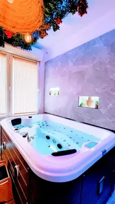 a large jacuzzi tub in a room at KosyKasa SPA in Cannes